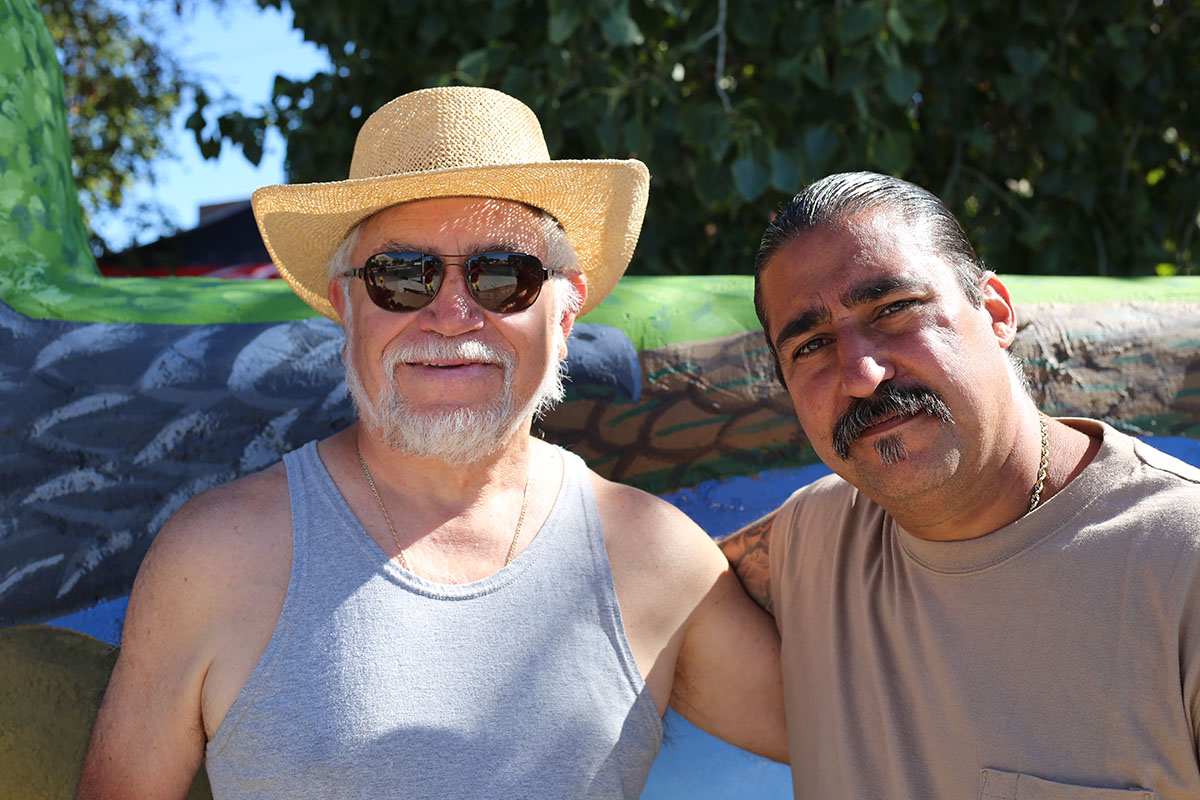 Photo of two New Mexican men. The artists.
