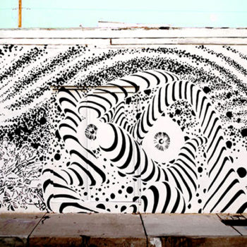 A trippy mural in just black and white of and abstracted universe. Kind of 70's inspired or like a black and white comic style.