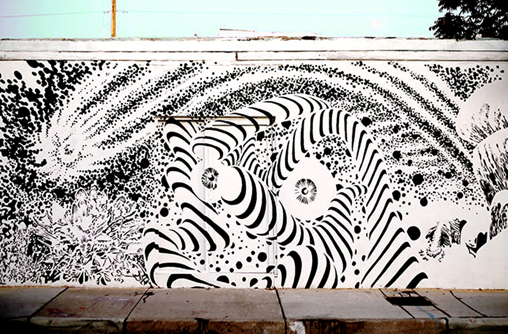 A trippy mural in just black and white of and abstracted universe. Kind of 70's inspired or like a black and white comic style.