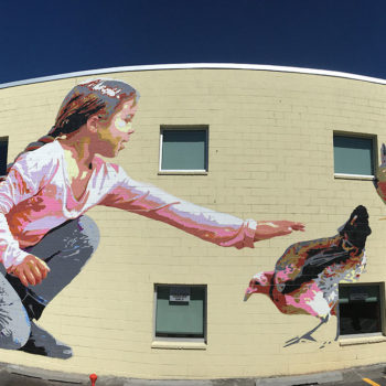 mural of girl petting chicken