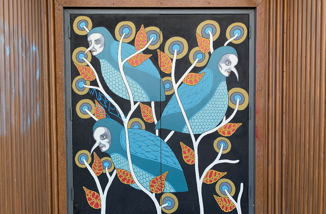 mural of masked birdmen